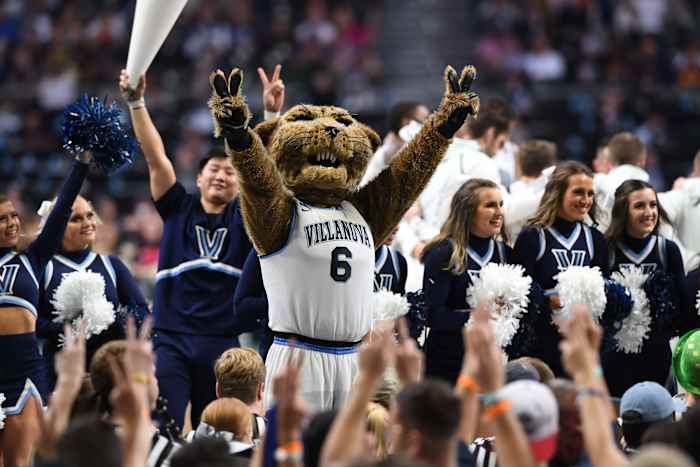 Villanova Wildcats cheerleaders and mascot celebrate during a basketball game.